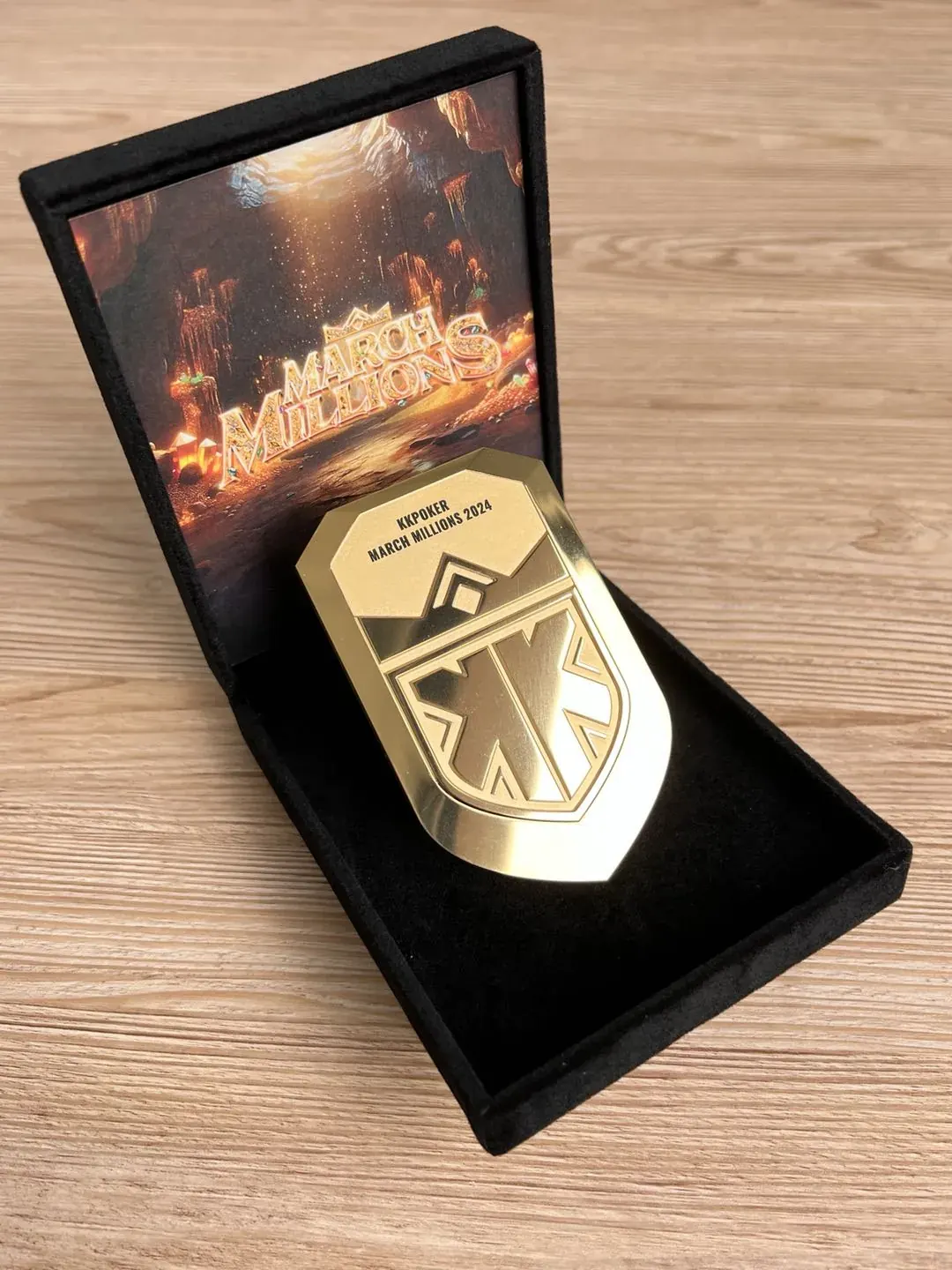 Close-up of the engraved medal in its box